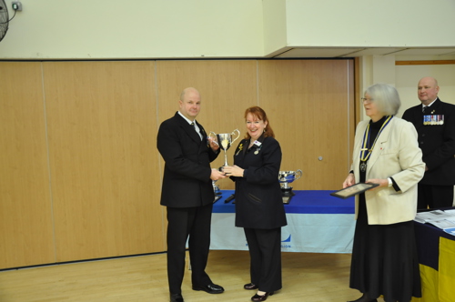 Mr Tjark Andrews collecting the County Standard Bearer Trophy